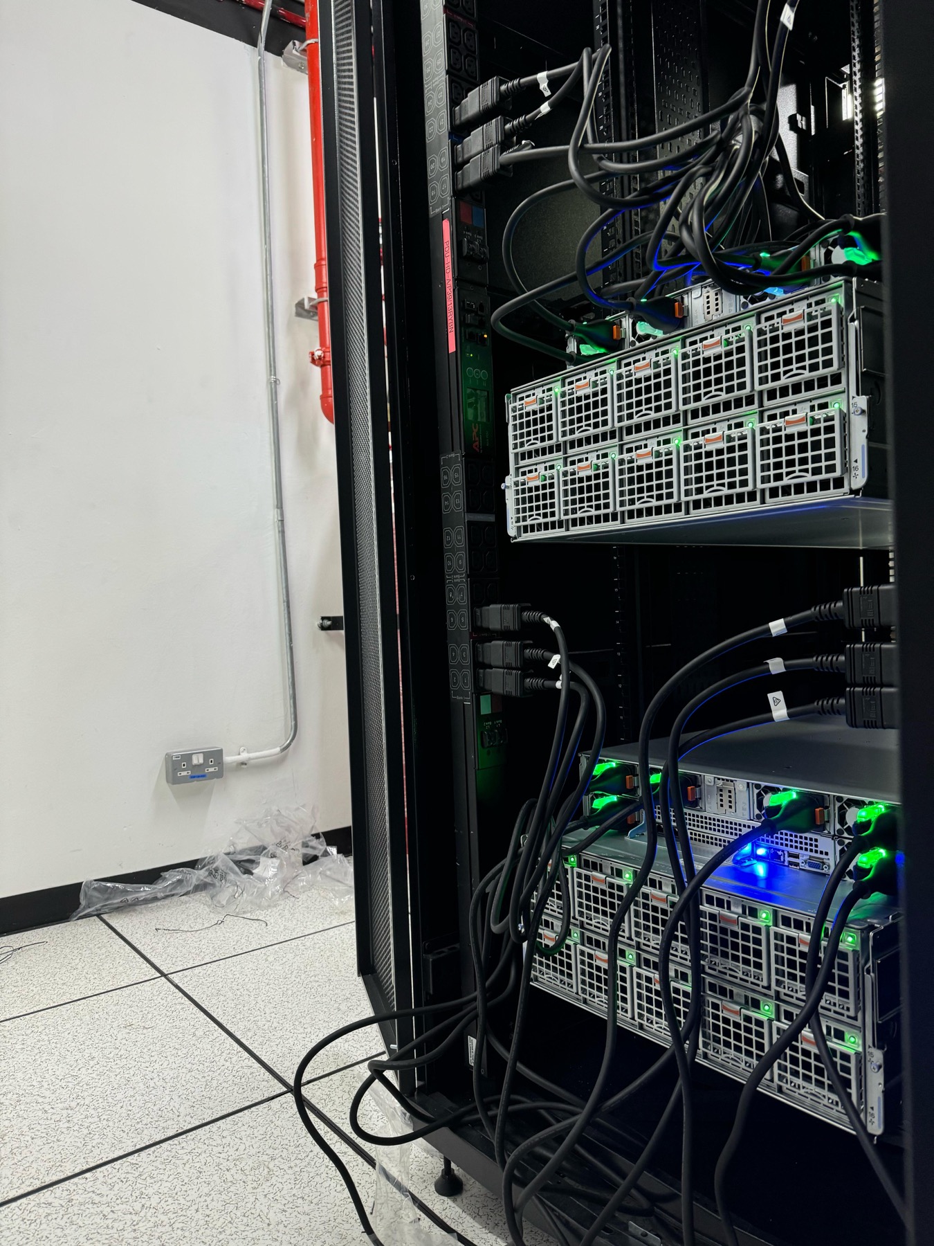 Cabled servers with active power and network connections inside a rack