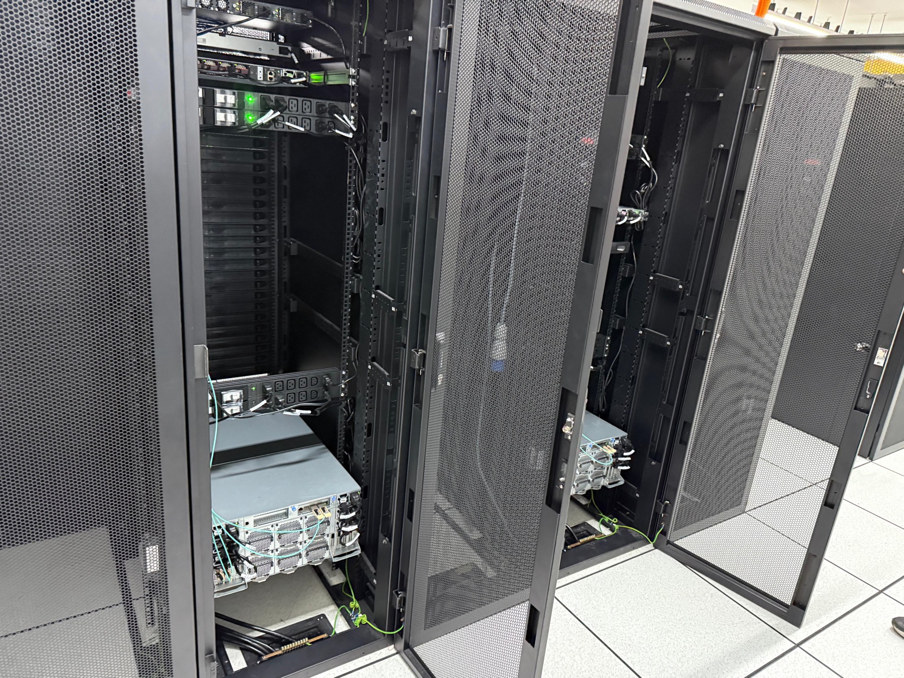 Open data center racks with power distribution and server hardware